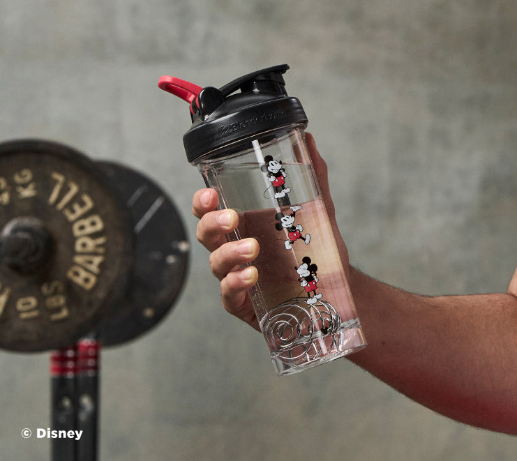 pro-series-w2 Mickey_Mouse_Protein_Shaker_Bottle_Being_Held_In_the_Gym.jpg